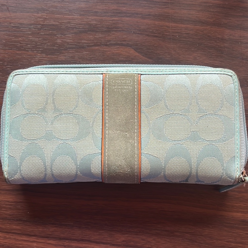 Coach wallet fabric with suede. Light blue color. Outside shows some wear.